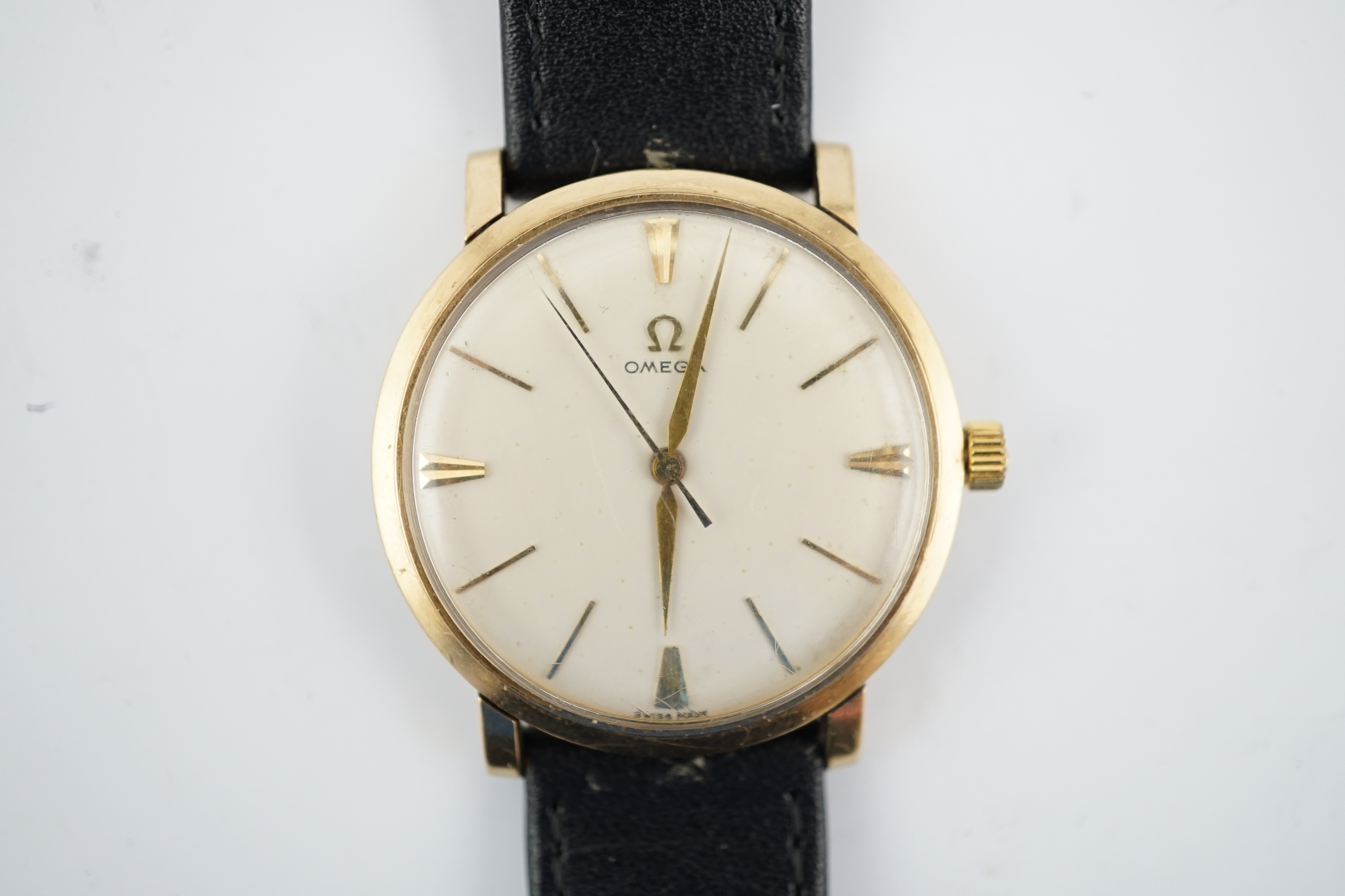 A gentleman's gold Omega manual wind wrist watch